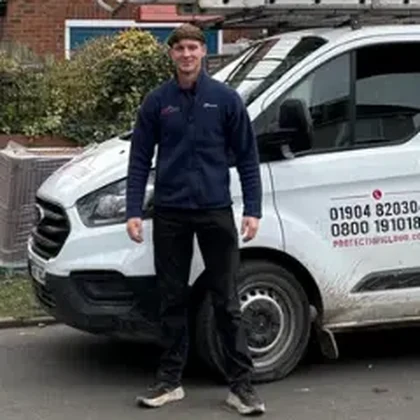Tommy Lee, owner of Protec Roofing, with the company van